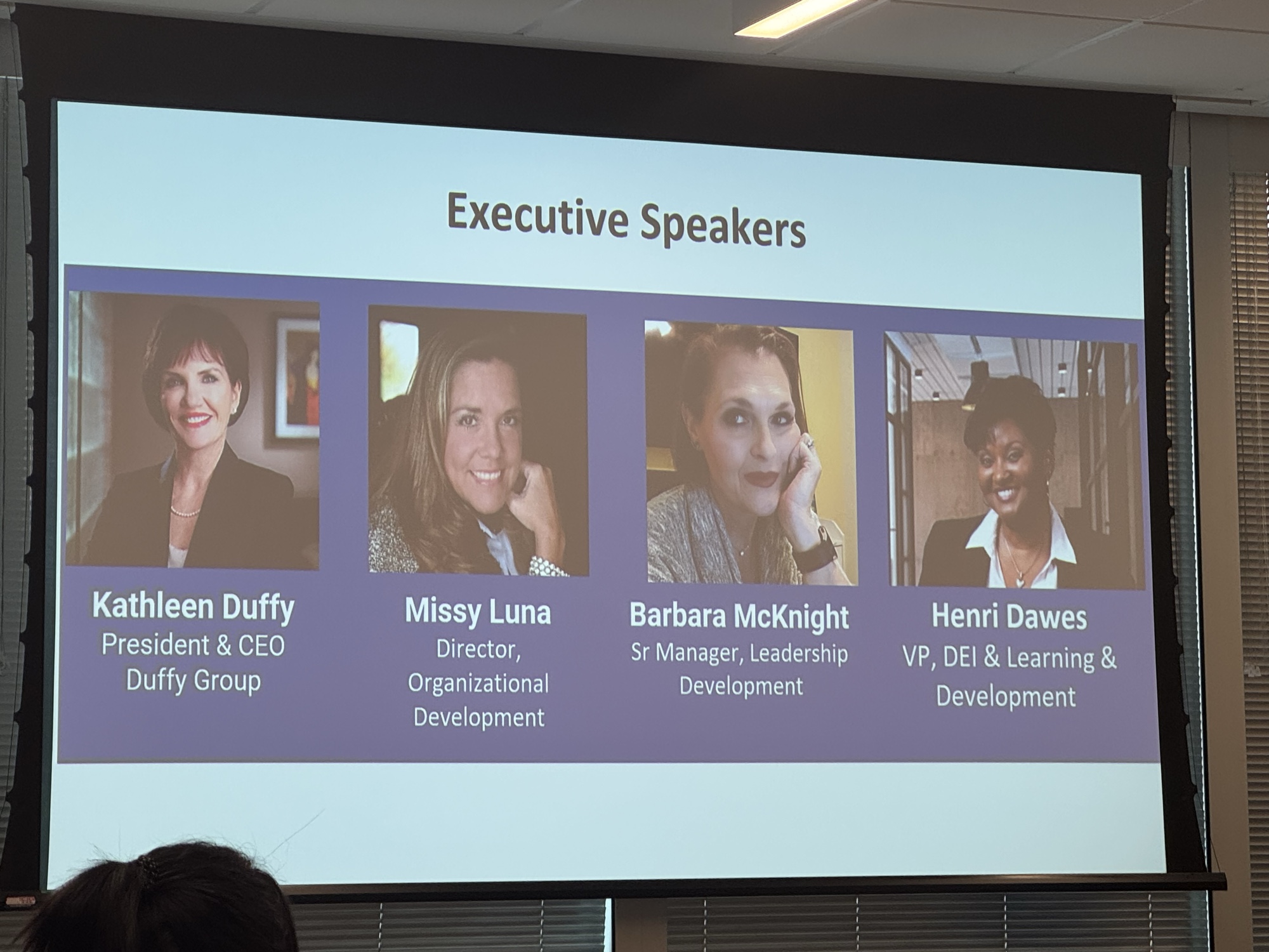 Executive Speakers slide from the 2025 Inspired LeadHER cohort featuring Kathleen Duffy, President and CEO of Duffy Group; Missy Luna, Director of Organizational Development; Barbara McKnight, Sr Manager of Leadership Development; and Henri Dawes, VP of DEI and Learning and Development.